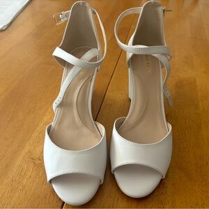 Pristine (never worn) wedge sandals.  Leather upper